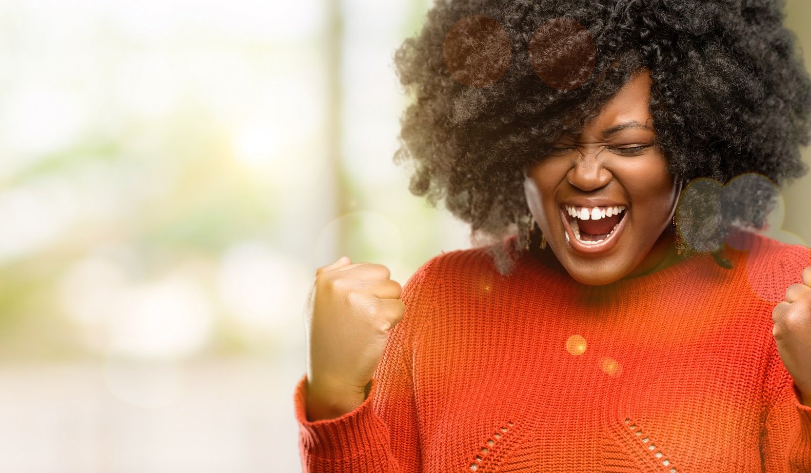 Beautiful african woman happy and excited celebrating victory expressing big success