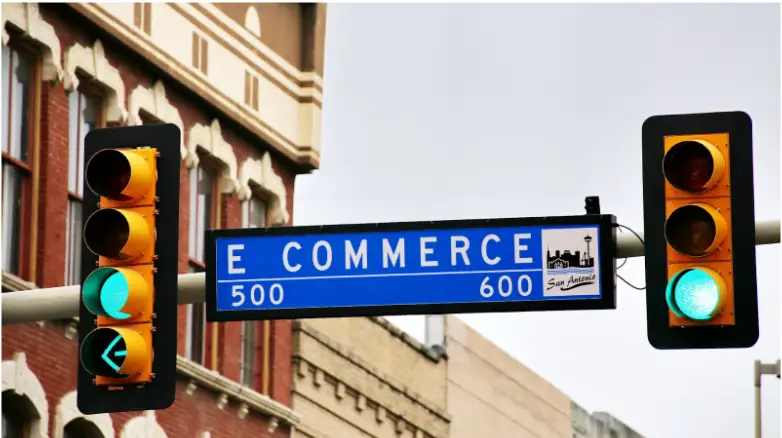 A street sign reading ‘E. Commerce.’