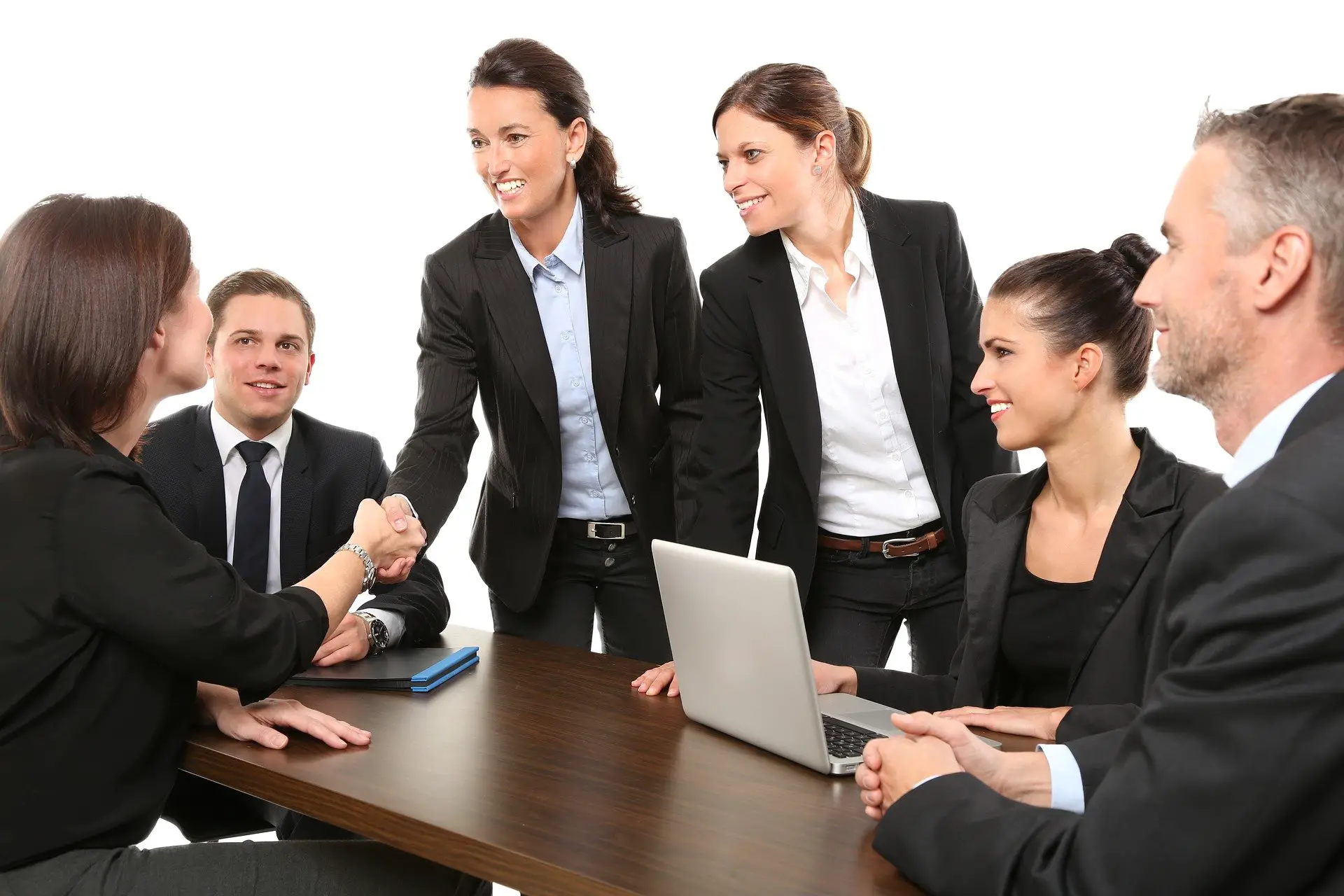 A group of professionals agreeing on a deal. | B2B SEO Strategy