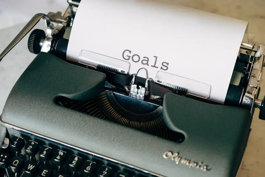 A typewriter spelling out the word ‘Goals.’