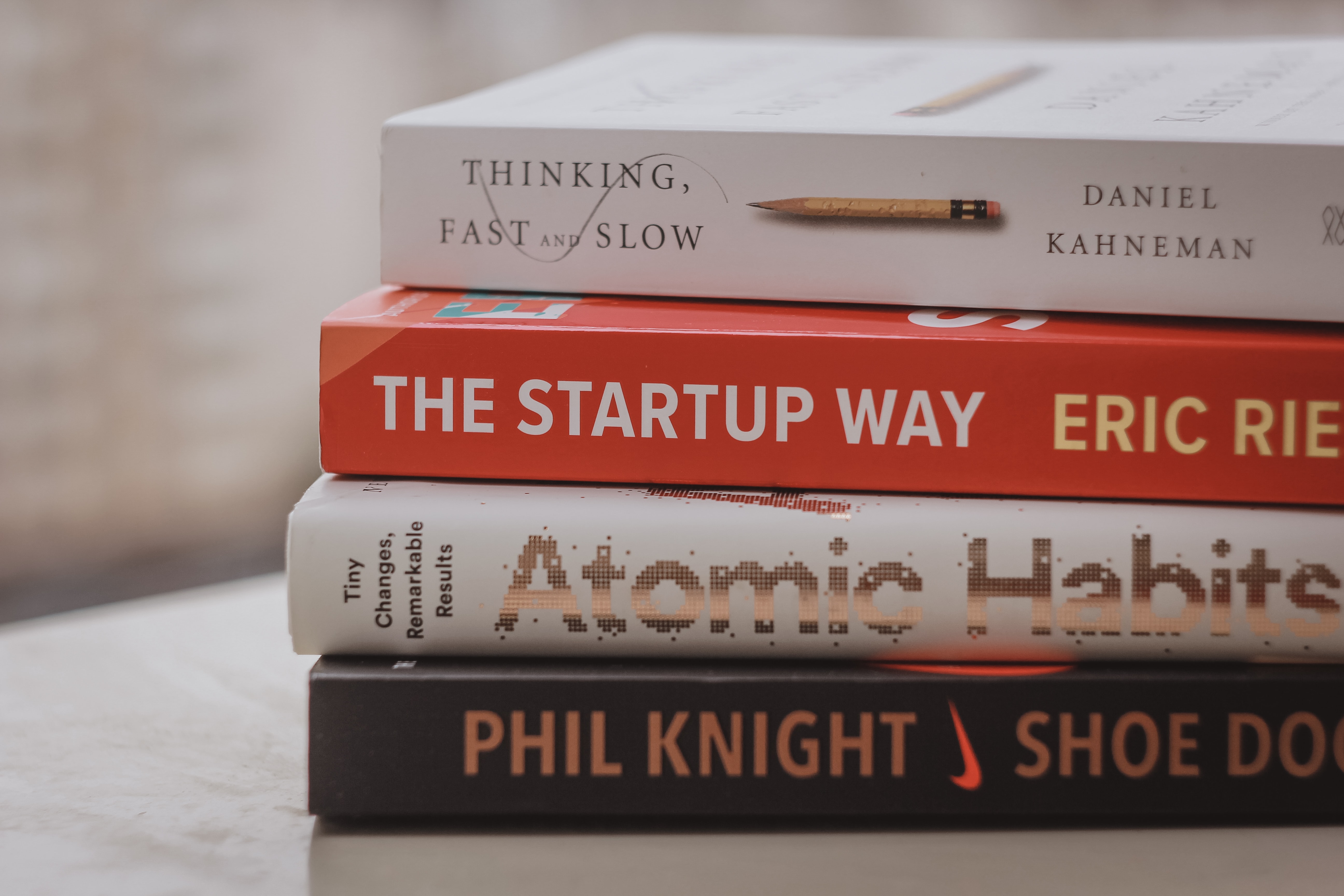 A stack of books with ‘The Startup Way’ in the middle.