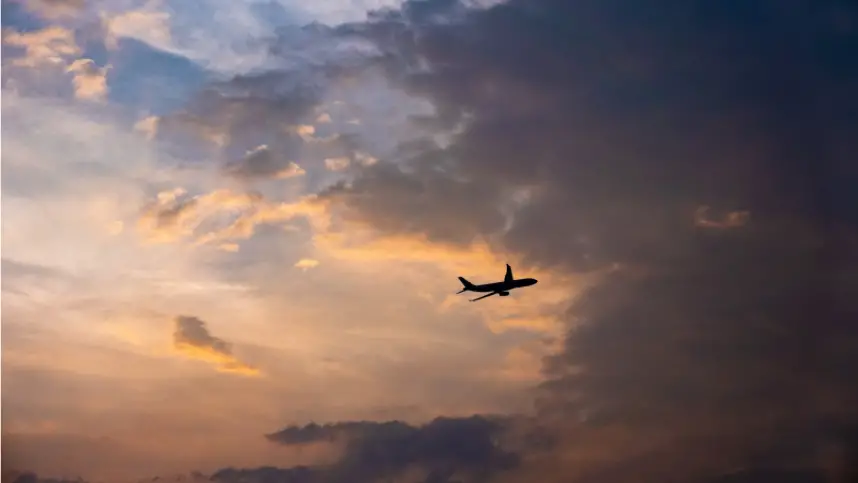 A plane traveling through the sky on autopilot.